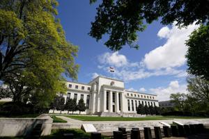Federal Reserve holds rates steady; three members dissent