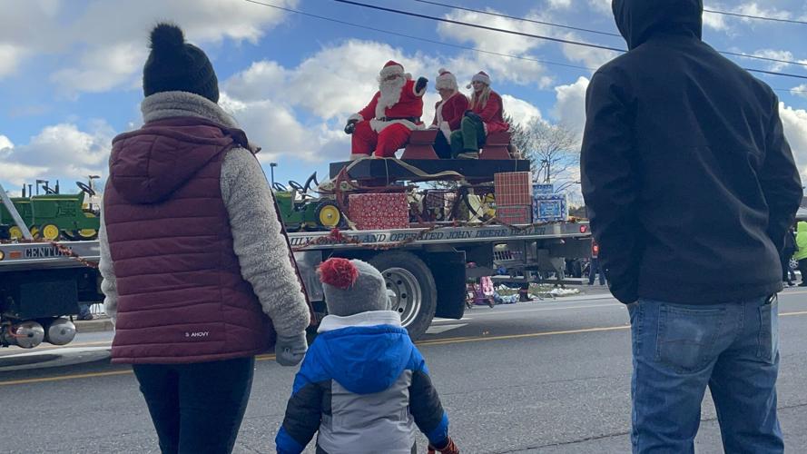 Santa waving to child South Glens Falls Holiday Parade