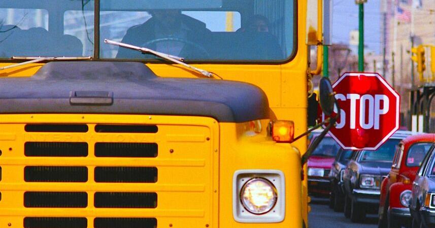 Reminder: Passing school buses picking up students is illegal