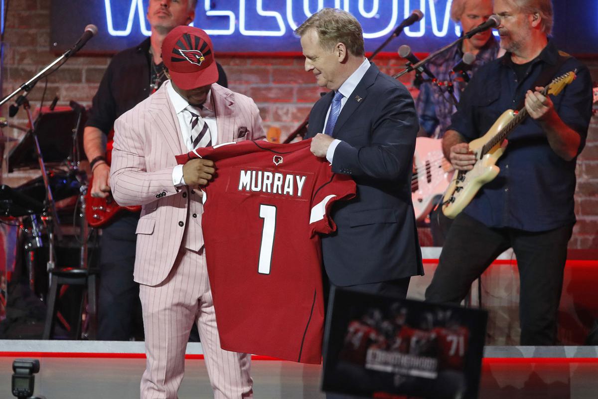 NFL commissioner Roger Goodell, middle, with Kyler Murray after the quarterback was drafted first overall by the Arizona Cardinals at the NFL Draft on April 25, 2019, in Nashville, Tenn.