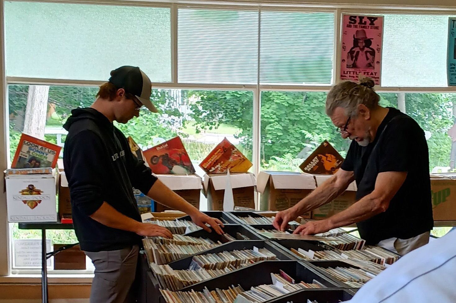 Robert Plant Browses Records In Glens Falls Prior To SPAC Show