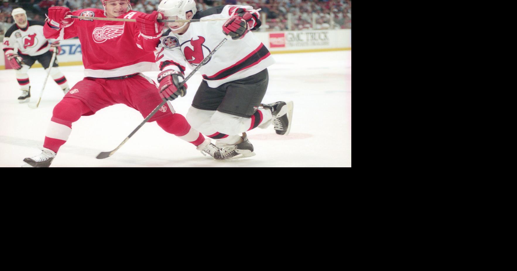 Detroit Red Wings' Rob DiMaio battles New Jersey Devils' Claude Lemieux during Game 4 of the Stanley Cup finals at Brendan Byrne Arena in East Rutherford, N.J., on June 24, 1995.