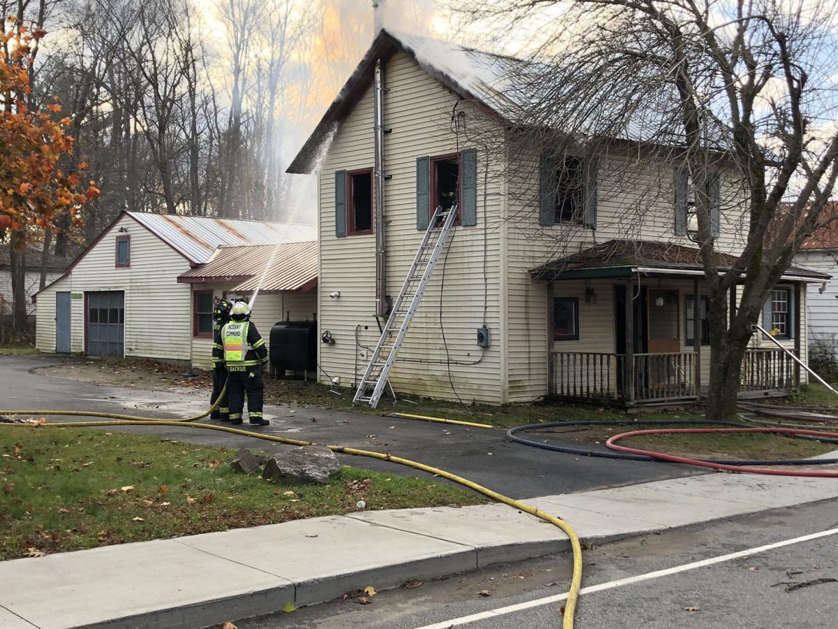 Firefighters battle house fire in Lake Luzerne