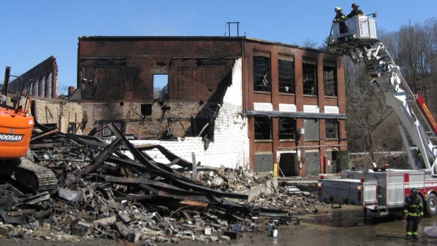 Fire burns former paper mill in Greenwich