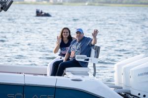 Phillies alum John Kruk waves to crowd as Grand Marshal at Night In Venice boat parade in Ocean City