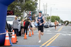 Participants in the Night In Venice 5K Run and 1 Mile Walk event at 19th Street in Ocean City, New Jersey