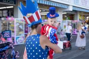 Seven-month-old Nikoa Petronzi from North Wildwood walks with his family during the annual Baby Parade on the Wildwood Boardwalk on July 29, 2026