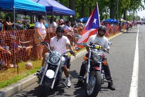 Antonio Perez and Rafael Martinez, motorcyclists from Vineland, riding in the 2026 Vineland Puerto Rican Festival Parade