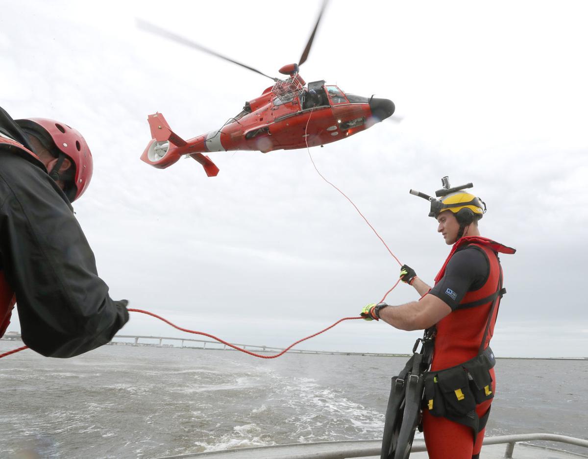 U.S. Coast Guard rescue swimmers act as paramedics in the water
