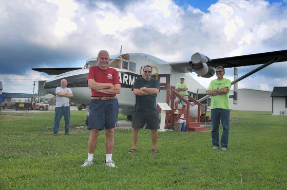 Volunteers Roy Wilson, from Mays Landing, left, Ron Frantz, George Lods, Dick Goldstine and Tim Jacobsen, all from Millville, pose in front of one of the vintage aircraft they are restoring at the Millville Army Air Museum.