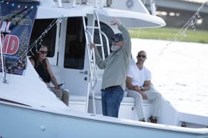 Actor Randy Quaid waves to the crowd at Night In Venice boat parade in Ocean City