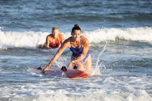 Lifeguards competing in water rescue events at the 56th annual Dutch Hoffman Memorial Lifeguard Championships in Wildwood, New Jersey