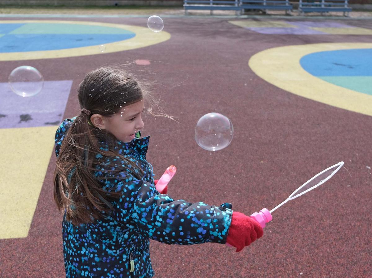 GALLERY 2019 students blow bubbles for Autism Awareness