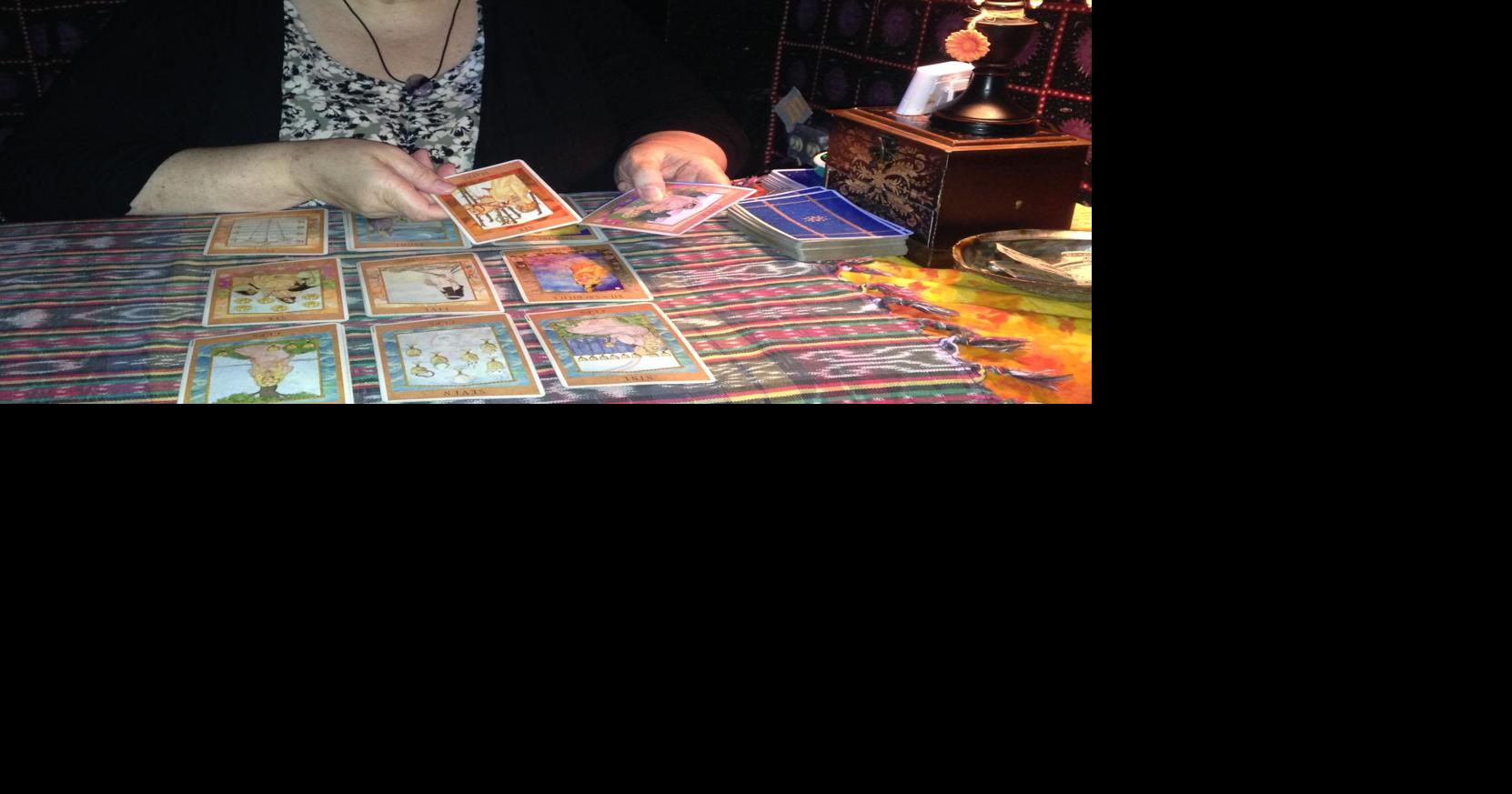 Boardwalk psychic uses tarot cards for a happy medium