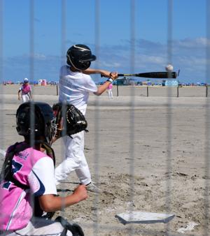 A scene from the MudHen Beach Baseball Tournament on the Rio Grande Avenue beach in Wildwood showing players competing in beach baseball
