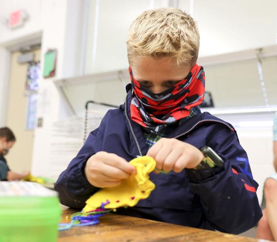 Kindergartners make dog toys for shelter dogs for World Kindness Day