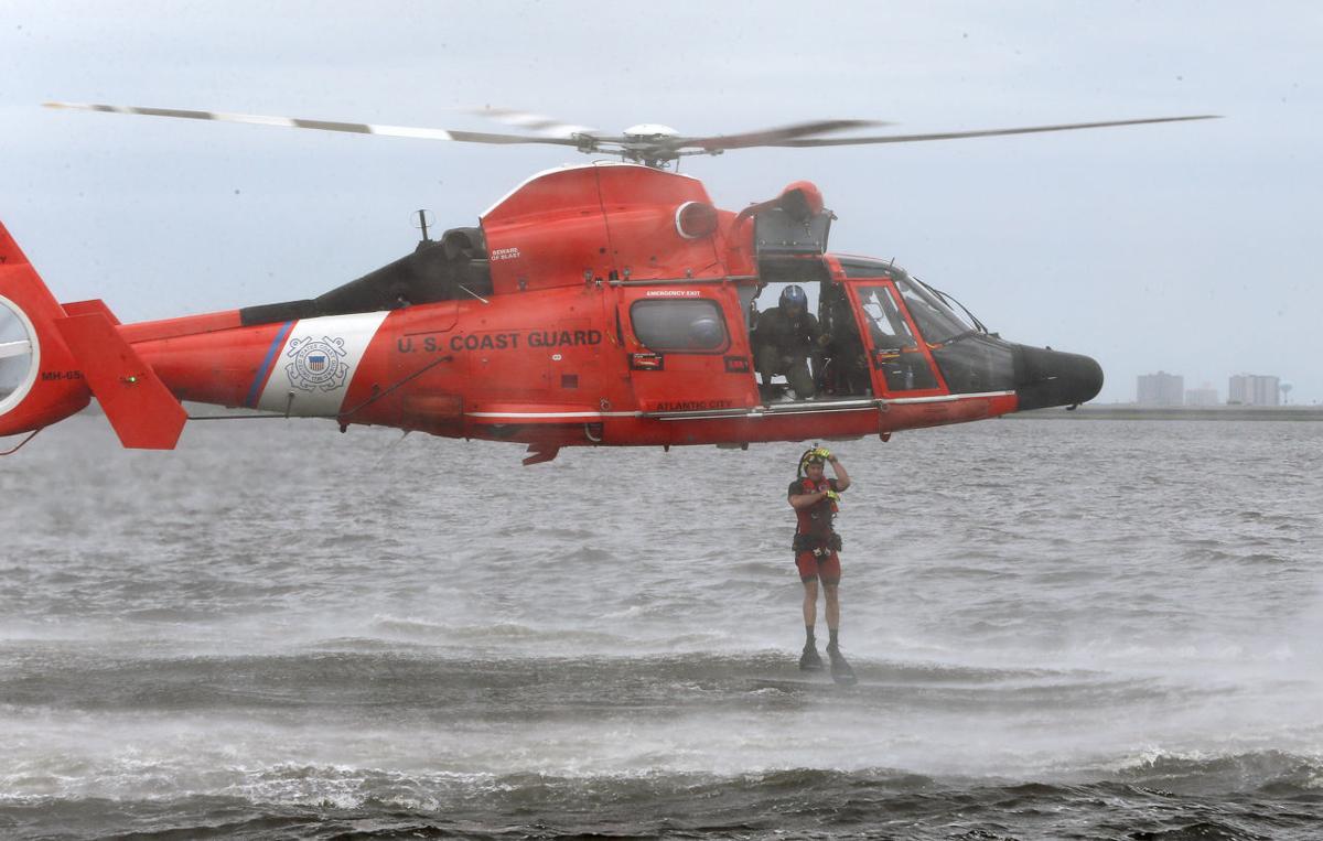 U.S. Coast Guard rescue swimmers act as paramedics in the water