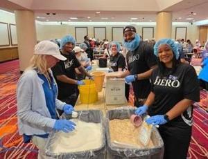 Harrah's Resort Atlantic City employees packaging food donations for local food banks and nonprofits