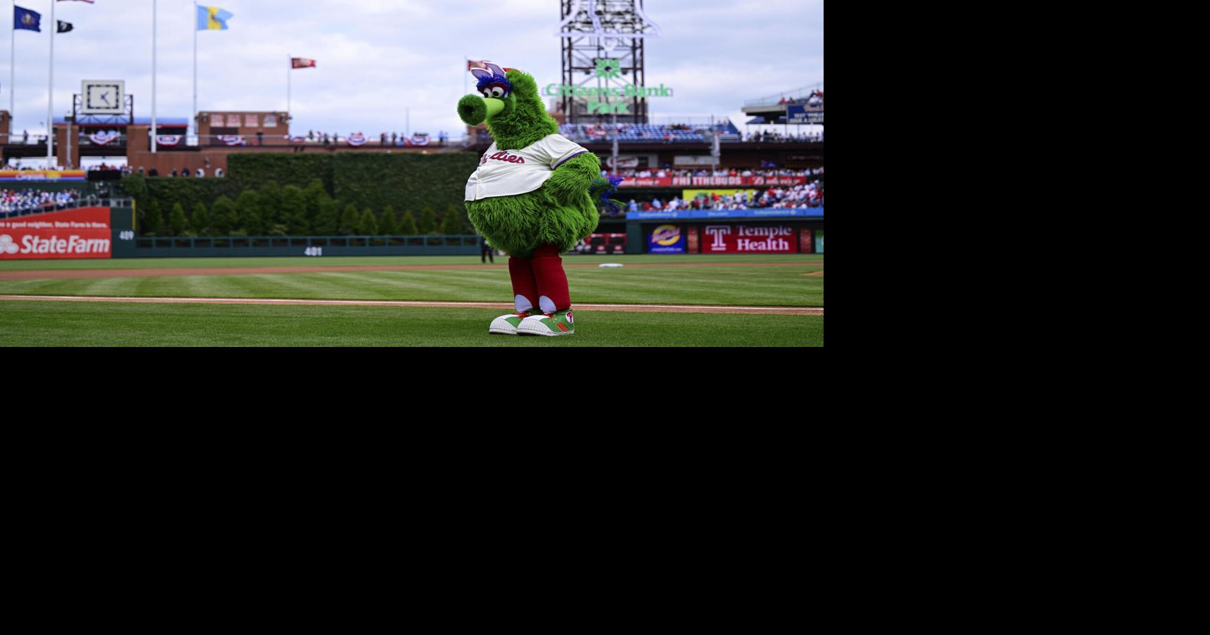 Phillies score three runs in the seventh to beat the Braves.