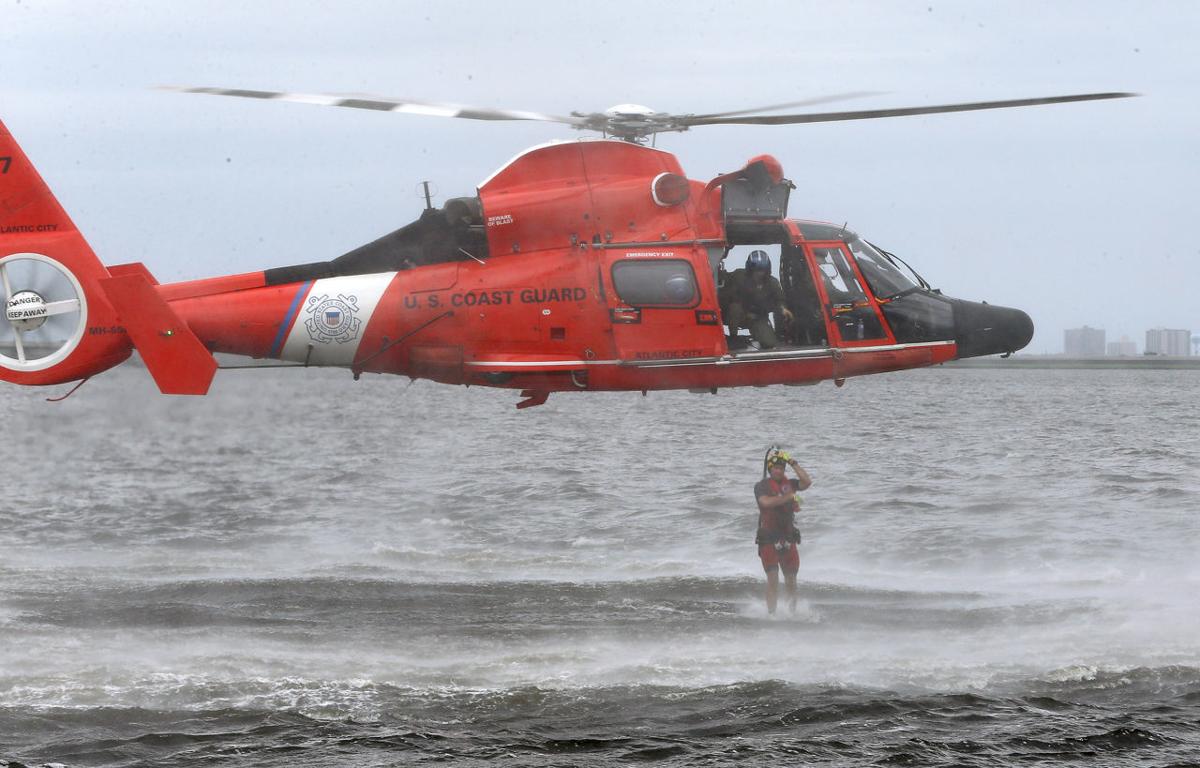 U.S. Coast Guard rescue swimmers act as paramedics in the water