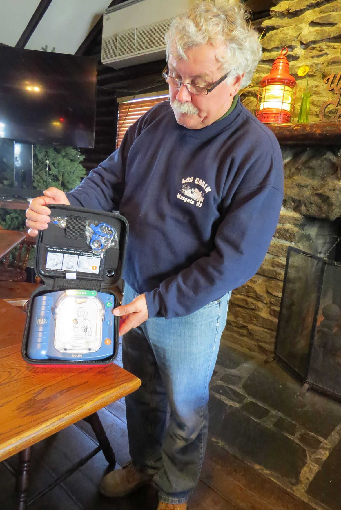 Police Firefighters Donate Aed To Log Cabin In Margate