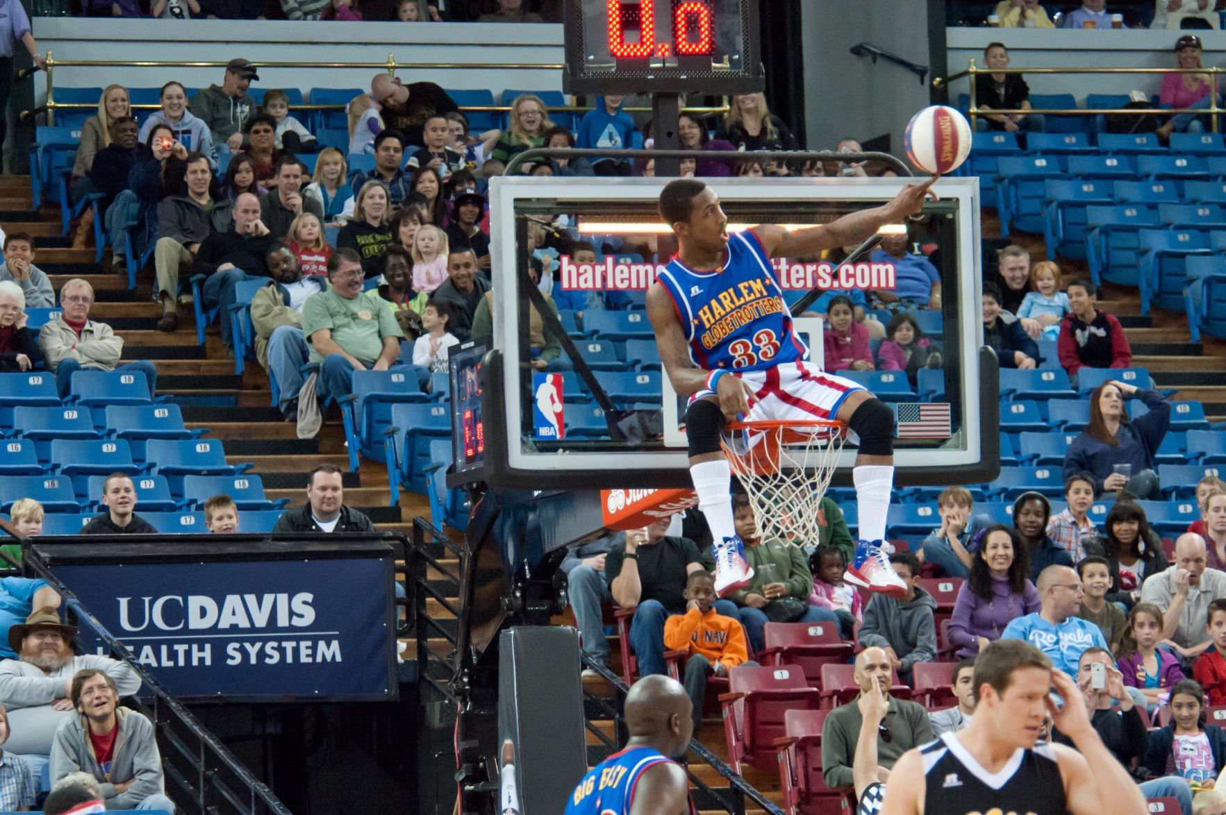 Watch this Harlem Globetrotter sink a 210-foot shot from a helicopter