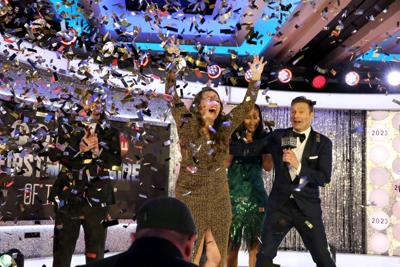 Sarah Day celebrates winning Powerball on behalf of Gary Krigbaum at Powerball First Millionaire of the Year during Dick Clark's New Year's Rockin' Eve With Ryan Seacrest 2023 on January 1, 2023 in New York City. (Photo by Rob Kim/Getty Images for dick ...