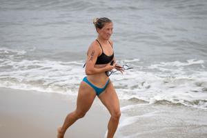 Katie Zgorski from Ocean City, Maryland leading during the paddle board portion of the Cape May Point Women's Lifeguard Challenge