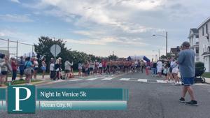 Participants in the Night In Venice 5k Run and 1 Mile Walk event on 19th Street in Ocean City, New Jersey