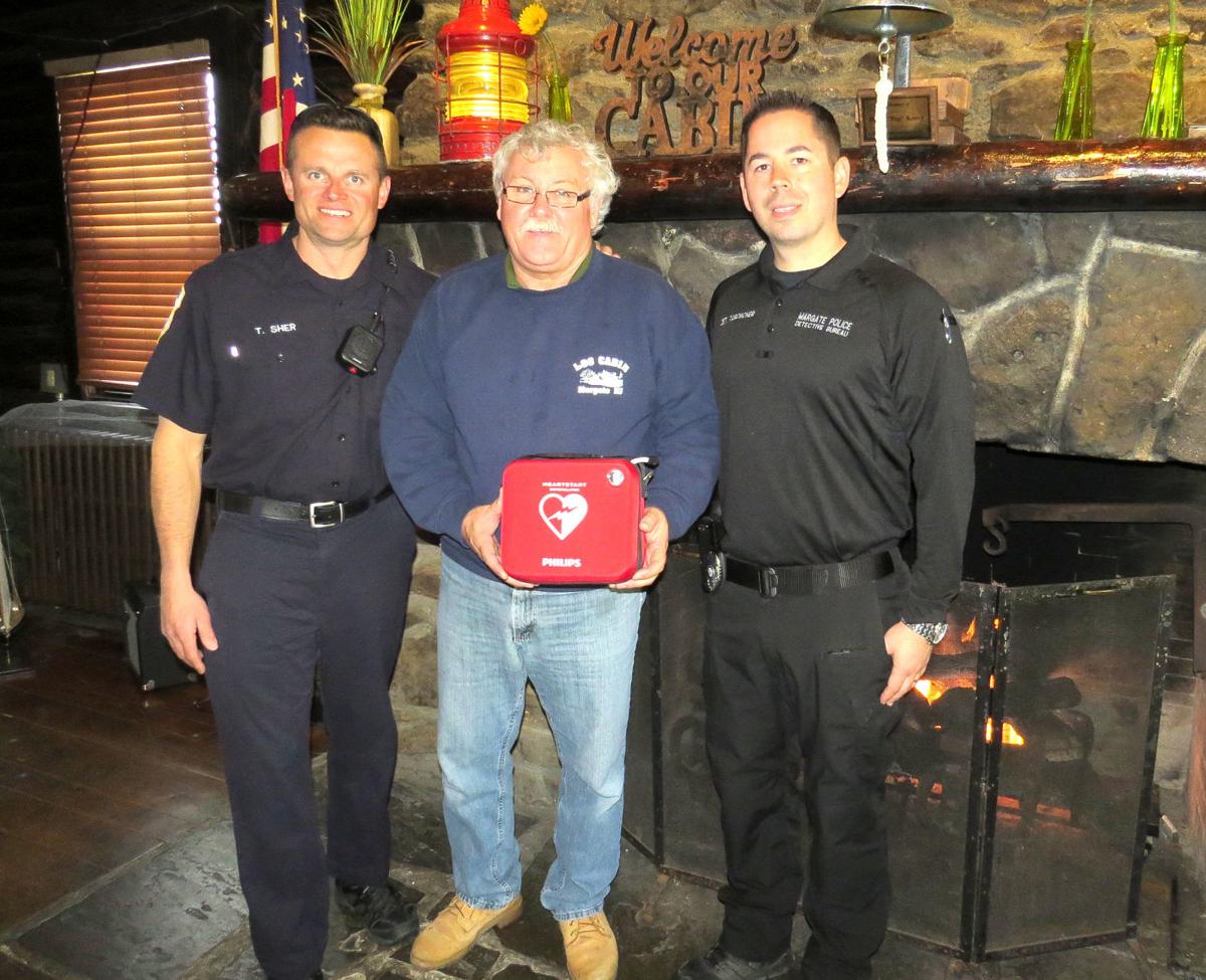 Police Firefighters Donate Aed To Log Cabin In Margate