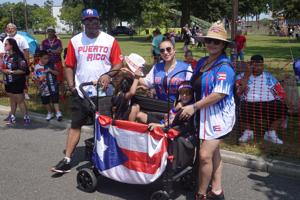 Mario Hamilton, Delaila Aguilar, Irene Hamilton, and children Marques and Mateo Hamilton at the 2026 Vineland Puerto Rican Festival Parade