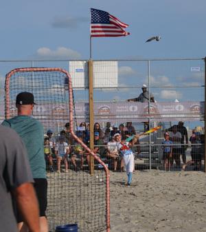 Players competing in the MudHen Beach Baseball Tournament on Rio Grande Avenue beach in Wildwood
