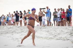Ivy Slavinski from Sea Girt emerging from the water during the Cape May Point Women's Lifeguard Challenge swimming component on July 22, 2026
