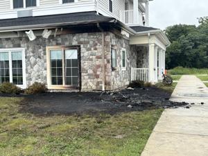 Scorched earth at Ridgewood Senior Living marking where a van caught fire overnight in Galloway Township