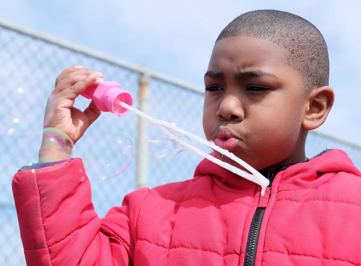GALLERY 2019 students blow bubbles for Autism Awareness