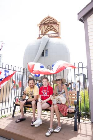 Visitors enjoy a snack near Lucy the Elephant during the landmark's 145th birthday celebration in Margate, New Jersey