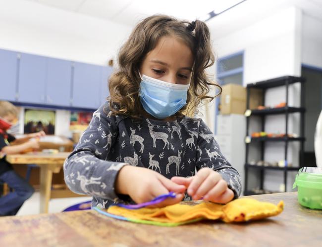 Kindergartners make dog toys for shelter dogs for World Kindness Day