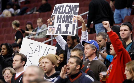 Denver Nuggets guard Allen Iverson encourages the fans after the