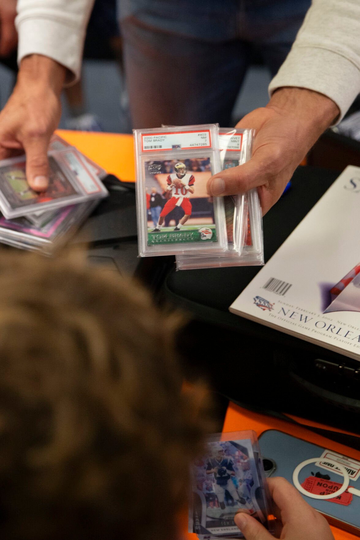 Tom Brady Makes Surprise Visit to Trading Card Store with Kevin Hart,  Travis Scott