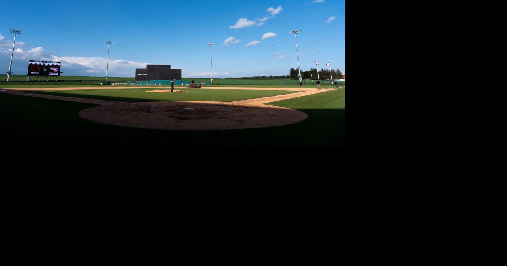 The grounds crew works on the field as the Clinton and Western Dubuque varsity baseball teams warm up June 17, 2026 at the Field of Dreams Ballpark in Dyersville, Iowa.