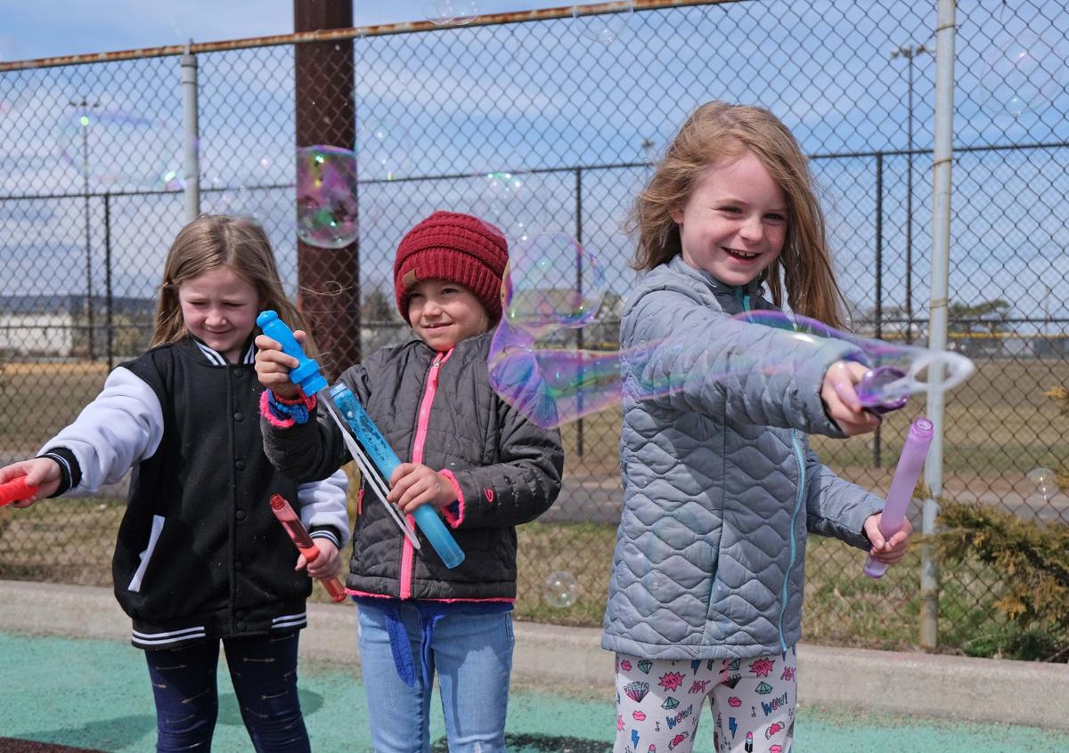 GALLERY Students blow bubbles for Autism Awareness Education