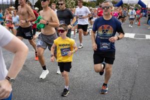 Participants running in the Night In Venice 5K Run and 1 Mile Walk at 19th Street in Ocean City, New Jersey on July 25, 2026