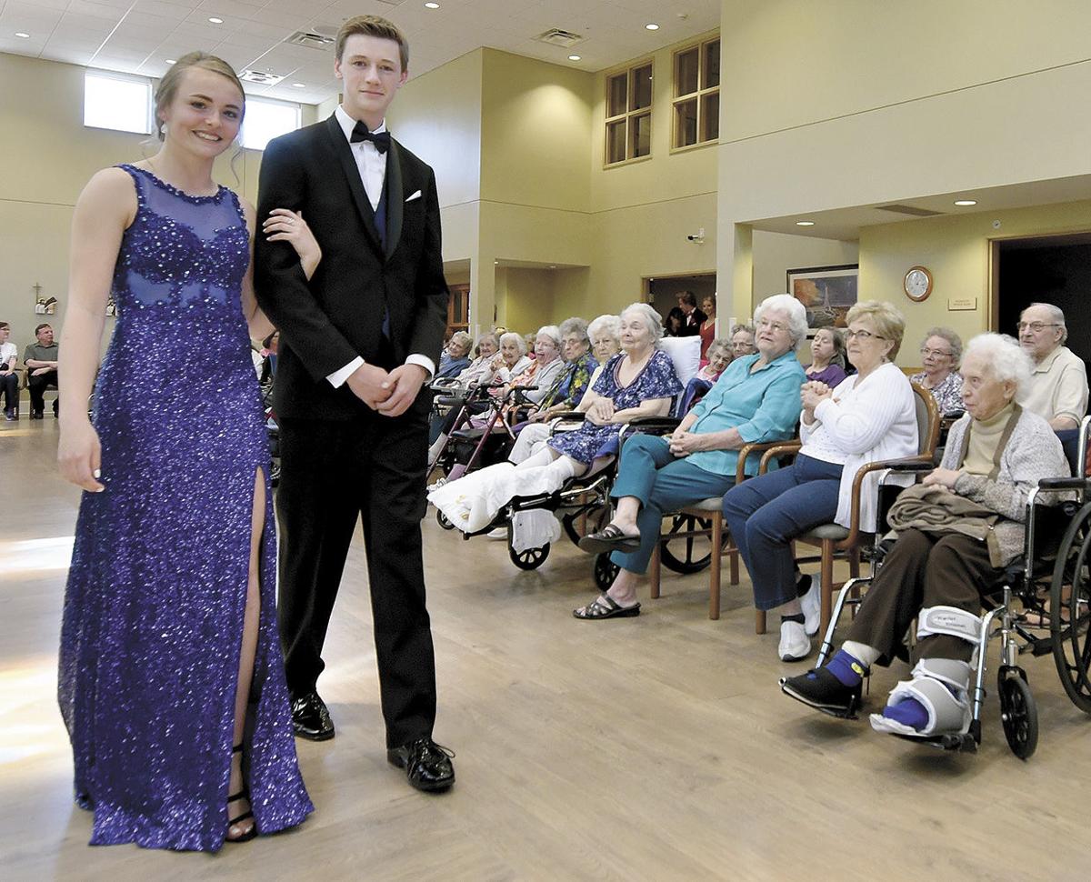 Students take a prom march through Cerenity Senior Care Students take a prom march through Cerenity Senior Care