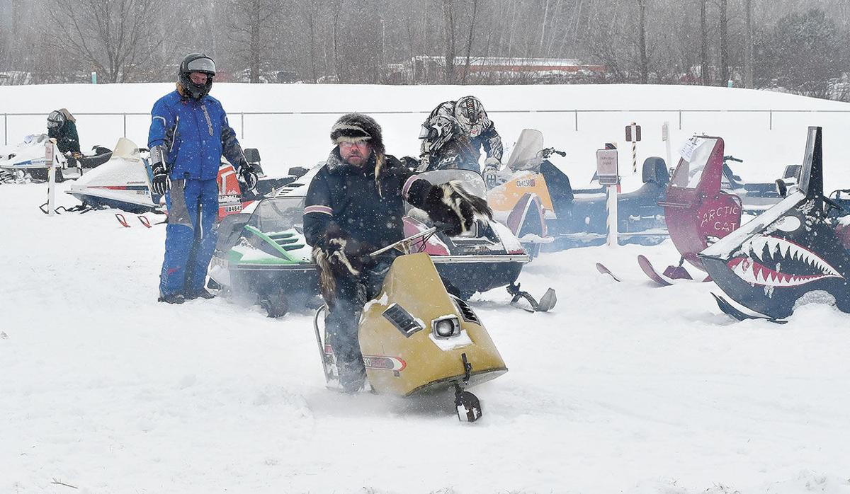 Hardy riders brave the cold and snow on vintage sleds