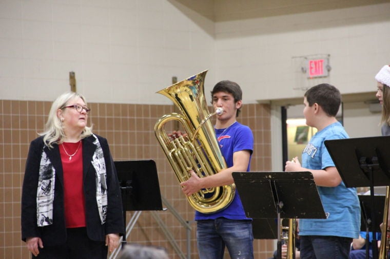 Spreading spirit Isanti Middle School band plays holiday tunes for