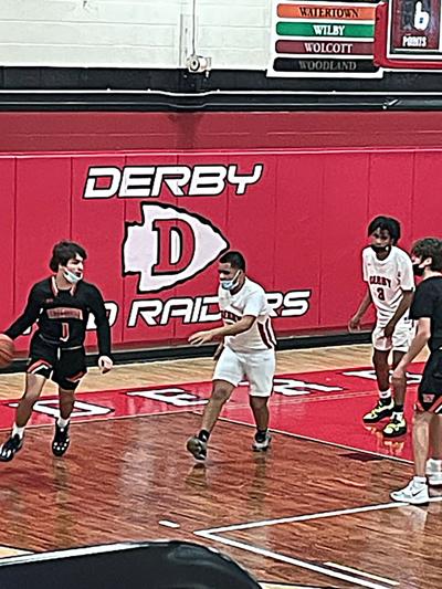 Derby Holds Off WHS Boys, 50-47