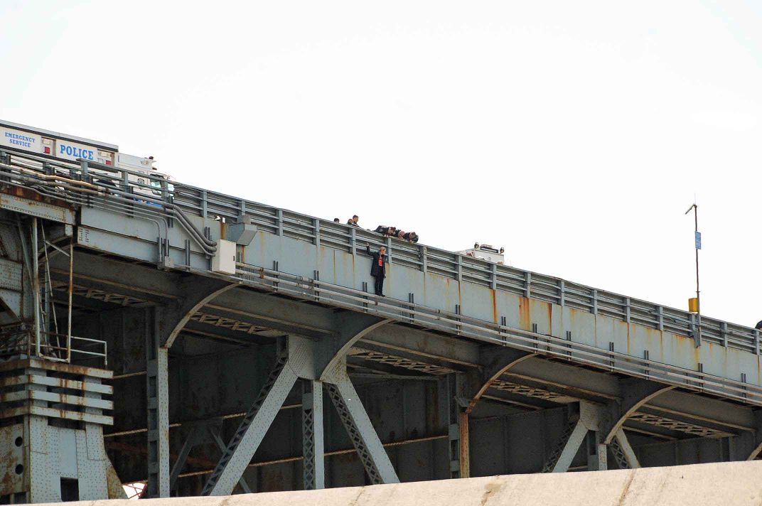 woman jumping off bridge