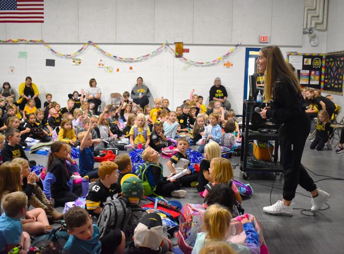 IOWA WOMEN'S BASKETBALL Martin stars in visit to Blue Grass Elementary