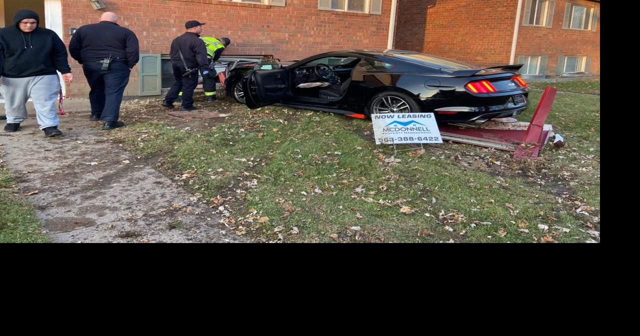 Car plows into apartment building