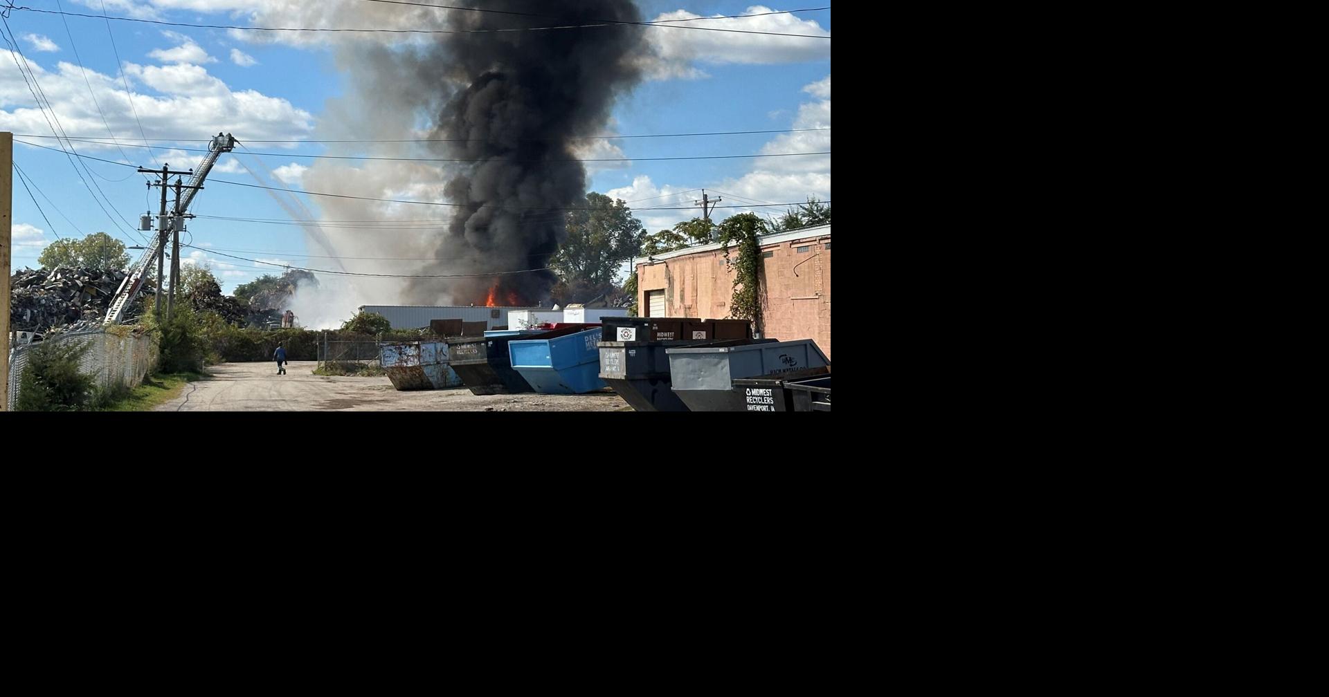 Davenport Fire Dept fights fire in pile of old cars on west side of city